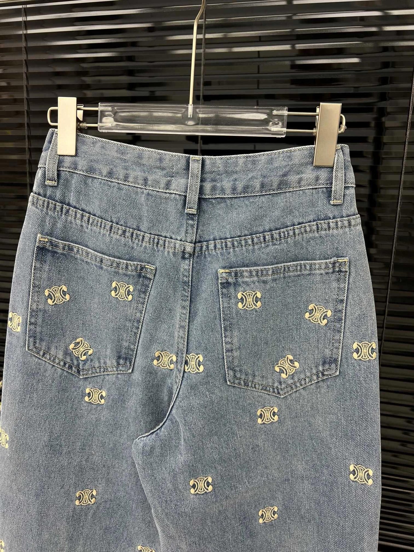 Denim trousers with all-over logo embroidery